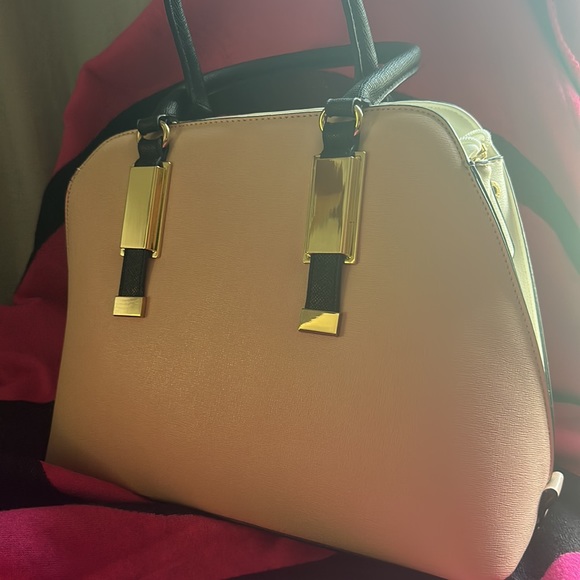 Tote style purse never used. Purse still has its original shape. - Picture 2 of 6